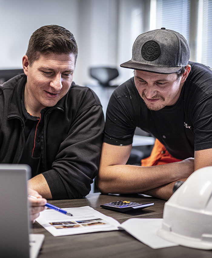 Three people planning in front of the computer